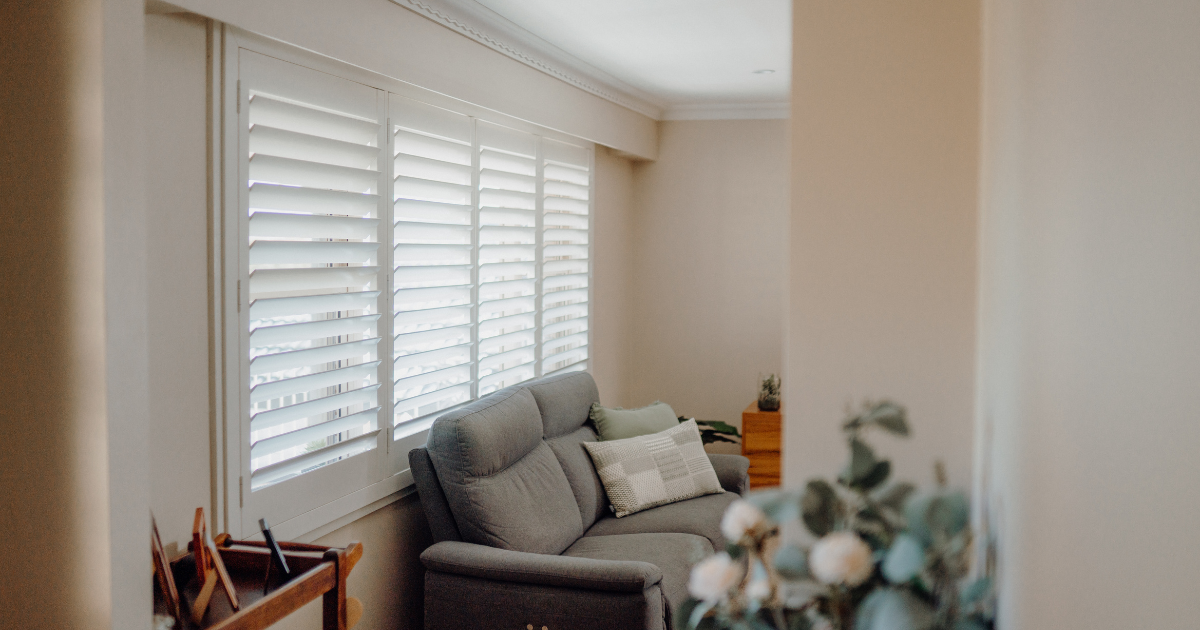 plantation shutters behind couch